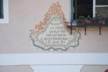 House inscription 'Maledica voce di Pluto più atroce s'alontani da qui - 1786' intended to protect the inhabitants from the detrimental influence of the ancient Roman god Pluto.